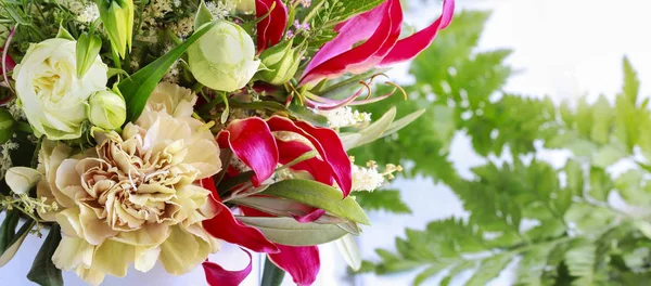 Flower background with gloriosa, carnations and roses. — Stock Photo, Image