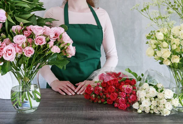 Florist working with roses.