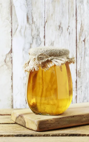 Honey in glass jar. — Stock Photo, Image