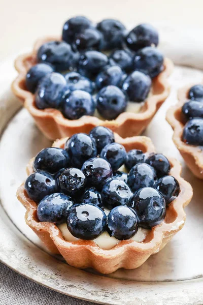 Bluberry cakes on silver plate. — Stock Photo, Image