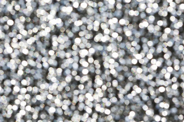 Silver glittering christmas lights. Blurred abstract background. — Stock Photo, Image