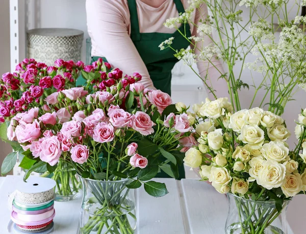 Florist working with roses.