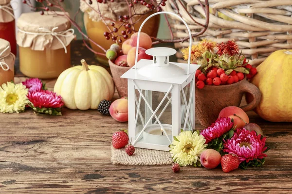Vintage iron lantern among autumn fruits, vegetables and plants. — Stock Photo, Image