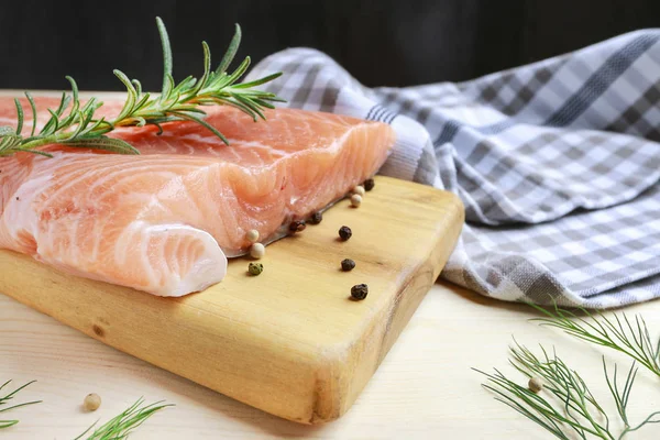 Raw salmon fillet on wooden background — Stock Photo, Image