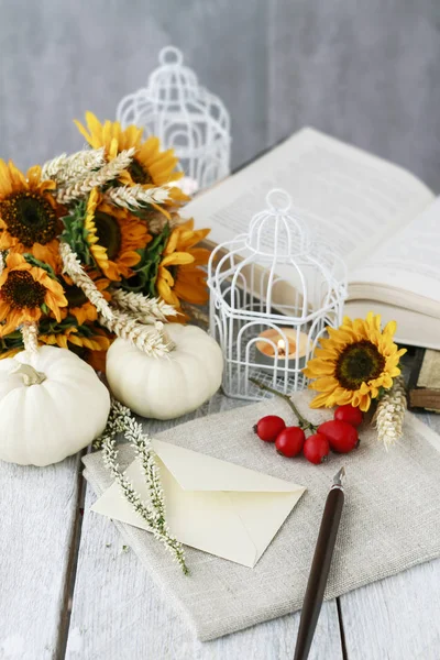 Sunflowers, white pumpkins and open book — Stock Photo, Image