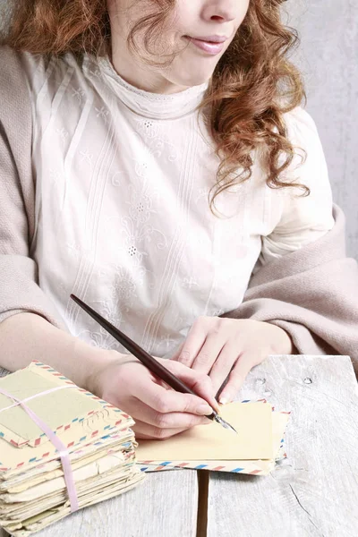 Young woman writing a letter. — Stock Photo, Image