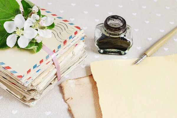 Stack of vintage love letters and apple tree flowers. — Stock Photo, Image