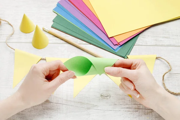 Woman making paper decorations