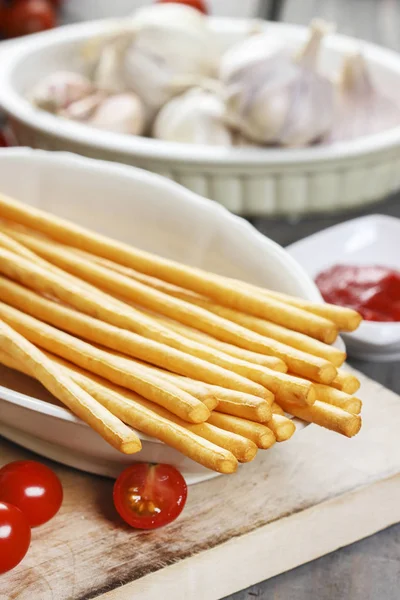 Traditional italian breadsticks on wooden table. — Stock Photo, Image