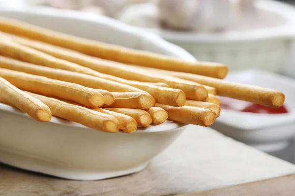 Traditional italian breadsticks on wooden table. — Stock Photo, Image