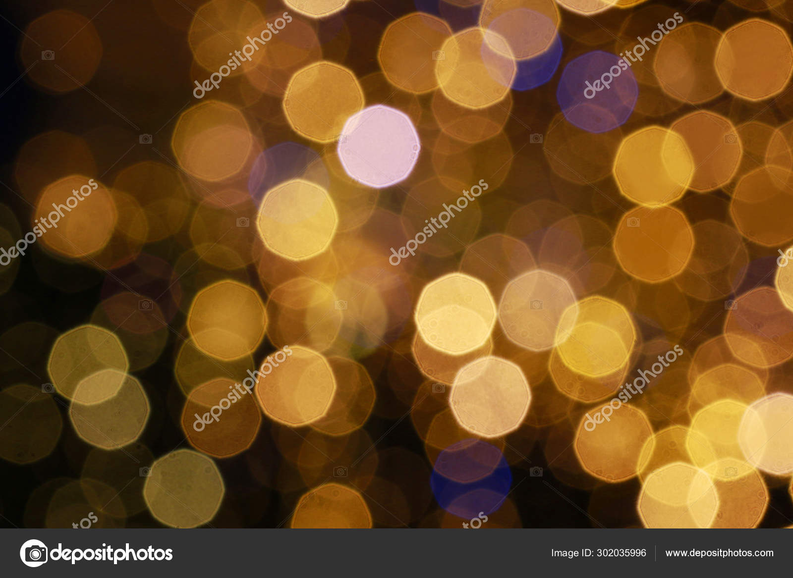 Gold glittering christmas lights. Blurred abstract background. Stock