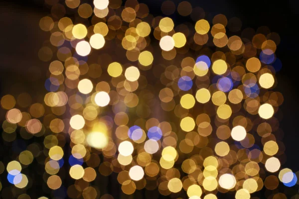 Gold glittering christmas lights. Blurred abstract background. — Stock Photo, Image