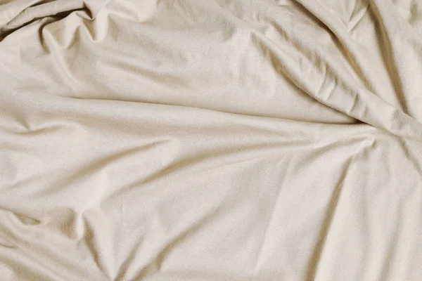 Fond de drap de lit beige . — Photo