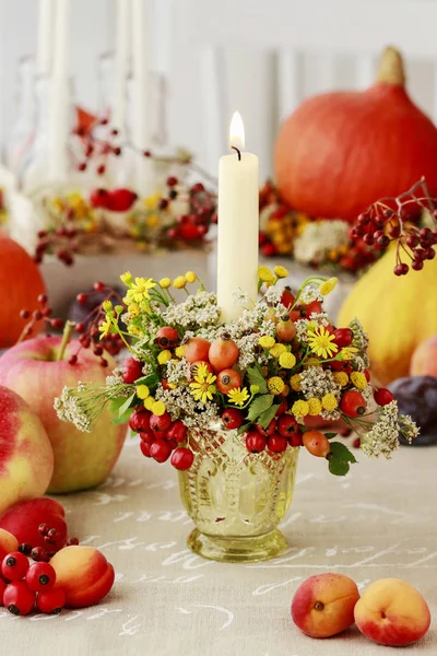 Autumn candle holder decorated with rose hip, hawthorn berries a — Stock Photo, Image