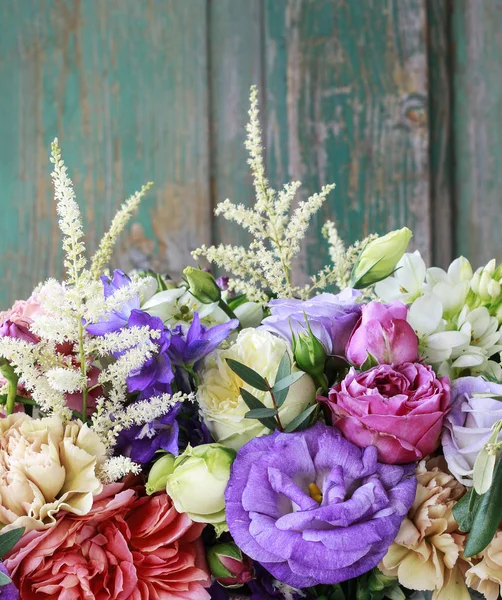 Flower background with rose, eustoma, carnation and spiraea. — Stock Photo, Image