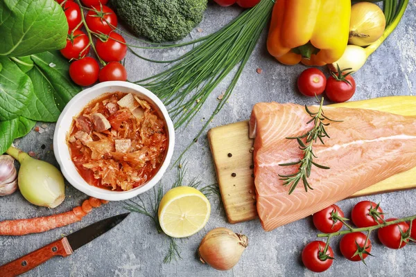 Pot of red vegetable soup on grey stone background. — Stock Photo, Image