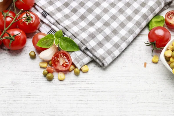 Checkered napkin and various vegetables around. — Stock Photo, Image