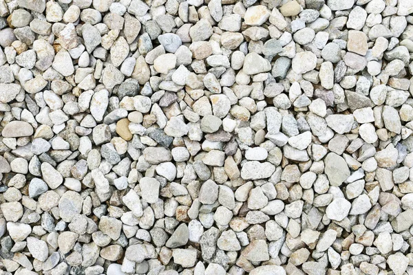 Natürlicher Hintergrund mit kleinen Steinen. — Stockfoto
