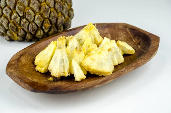 Edible part of marolo,  araticum or bruto fruit  on wooden bowl . Tropical  fruit of the original inhabitants of Brazil and Paraguai. Scientific name ; Annona crassiflora.