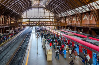 SAO PAULO , BRAZIL 14 JULY 2018 ; Moving inside the Luz Station, trains and passengers at the boarding and landing platforms, in the Bom Retiro neighborhood. clipart