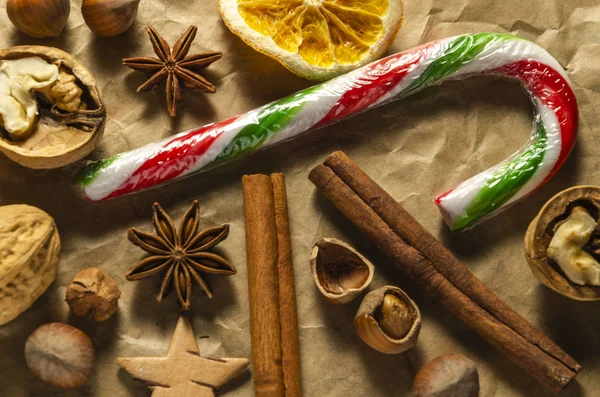 Variety Christmas Food Products Nuts Cinnamon Stick Lollipop Orange Slice — Stock Photo, Image