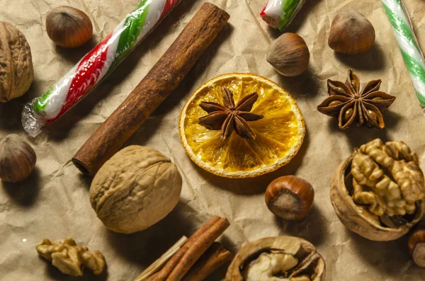 Variety Christmas Food Products Nuts Cinnamon Stick Lollipop Orange Slice — Stock Photo, Image