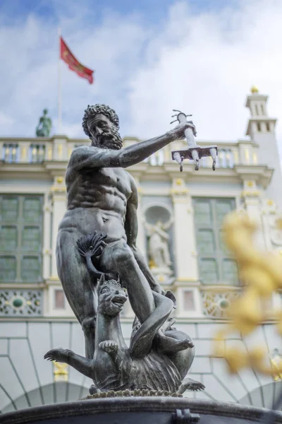 Historic Neptune Fountain on Long Market in old town Gdansk, Poland. It is a popular meeting point and tourist attraction.