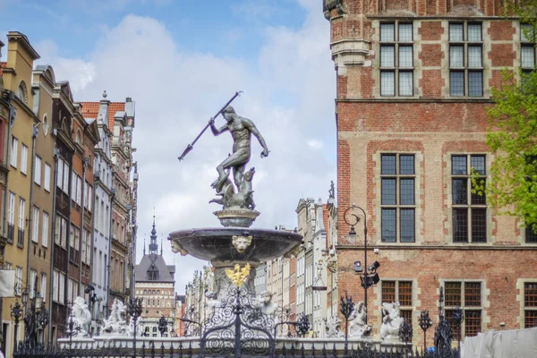 Historic Neptune Fountain on Long Market in old town Gdansk, Poland. It is a popular meeting point and tourist attraction.