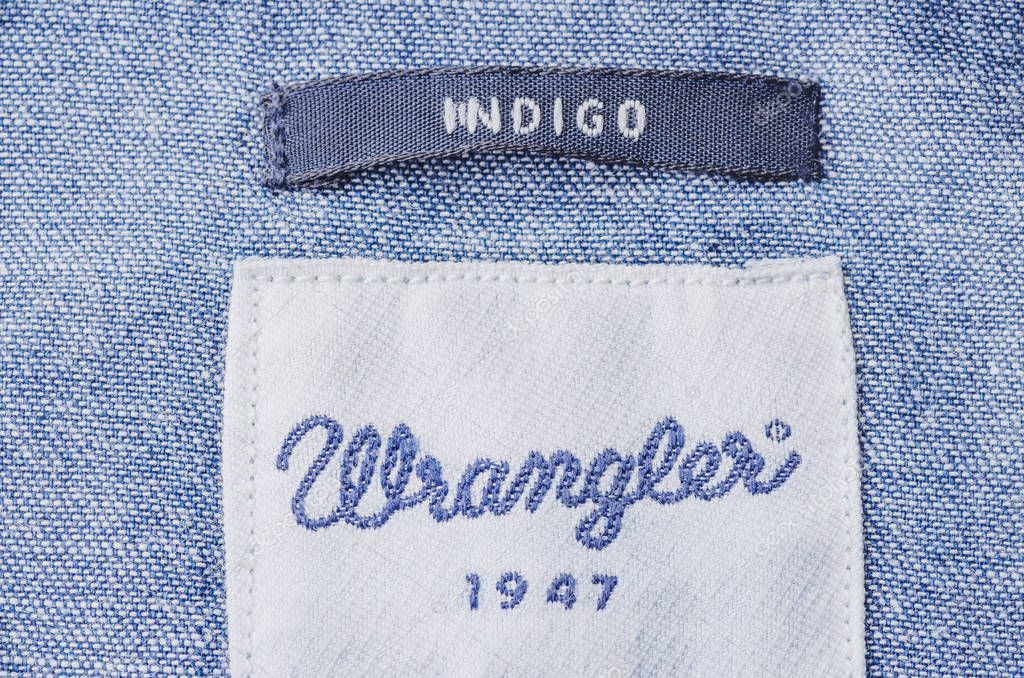 Closeup of Wrangler label on a shirt. Wrangler is American manufacturer of jeans. Its headquarters is in Greensboro, North Carolina, USA
