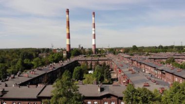 Arial view on the historic mining town Nikiszowiec in Katowice. Mine in the background. Katowice / Poland - 04.2020. 4K, UHD, Cinematic