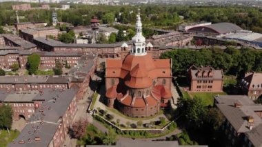 Arial view on the historic mining town Nikiszowiec in Katowice. Mine in the background. Katowice / Poland - 04.2020. 4K, UHD, Cinematic