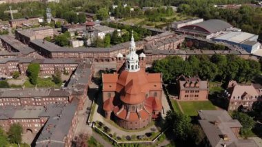 Arial view on the historic mining town Nikiszowiec in Katowice. Mine in the background. Katowice / Poland - 04.2020. 4K, UHD, Cinematic