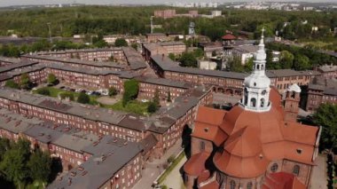 Arial view on the historic mining town Nikiszowiec in Katowice. Mine in the background. Katowice / Poland - 04.2020. 4K, UHD, Cinematic