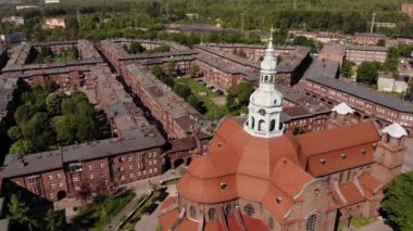 Arial view on the historic mining town Nikiszowiec in Katowice. Mine in the background. Katowice / Poland - 04.2020. 4K, UHD, Cinematic