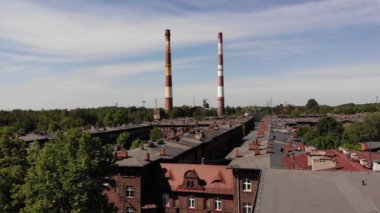 Arial view on the historic mining town Nikiszowiec in Katowice. Mine in the background. Katowice / Poland - 04.2020. 4K, UHD, Cinematic