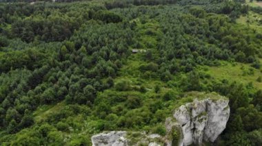 Arial view on a hole in the rock. Rocks. Forest in background. 4K, UHD, Cinematic