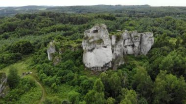 Arial view on a hole in the rock. Rocks. Forest in background. 4K, UHD, Cinematic
