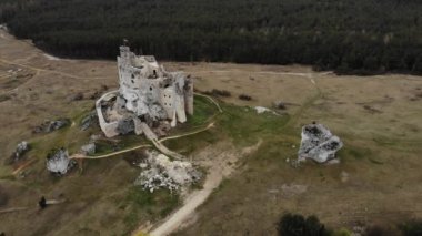 Arial view on a historic castle in Mirow. Jura Cracow. Poland - 05.2020. 4K, UHD, Cinematic