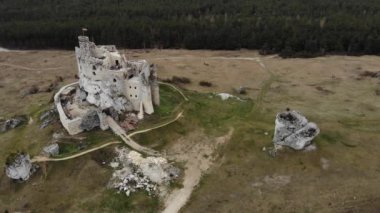 Arial view on a historic castle in Mirow. Jura Cracow. Poland - 05.2020. 4K, UHD, Cinematic