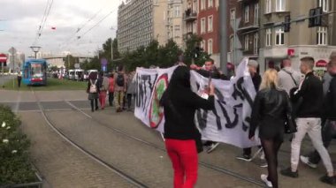 Katowice / Poland - 10.10.2020. The March anti Covid-19. People without masks move around the city. 4K, UHD, 50p, Cinematic.