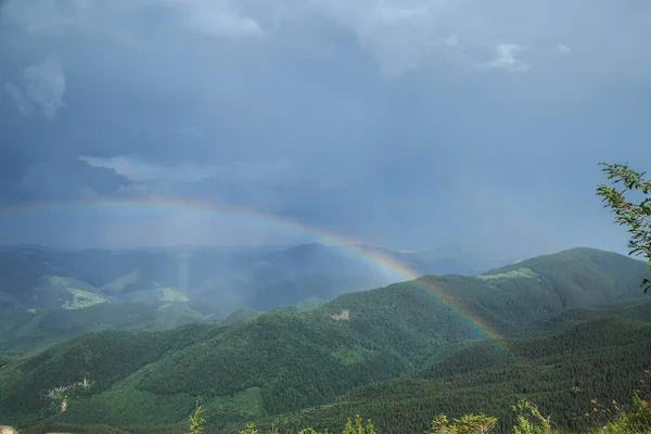 scenic view of rainbow over Mountain Smotrych, Carpathian mountains, Ukraine