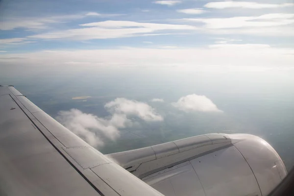 view over clouds through plane window