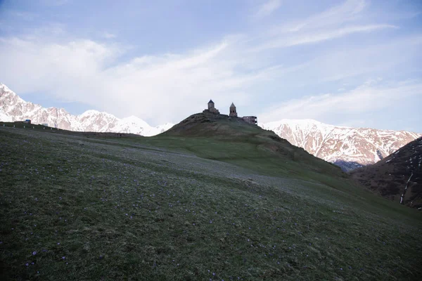 view of Tbilisi ancient church on mountains background