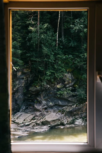 view of through window on stoned hill at Yaremche, Ukraine