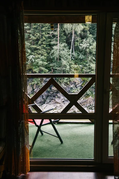 view of through window on stoned hill at Yaremche, Ukraine