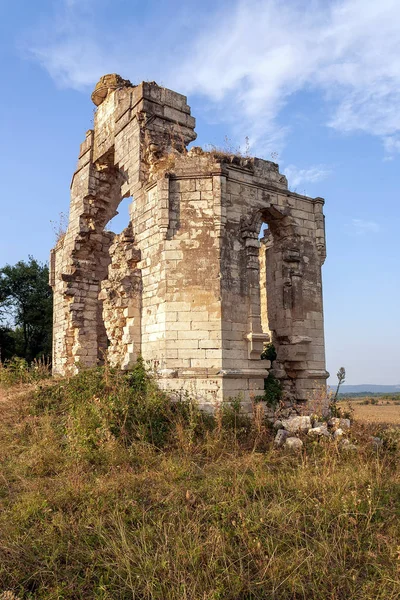 Ruined old chapel on the outskirts of the village in the evening light.