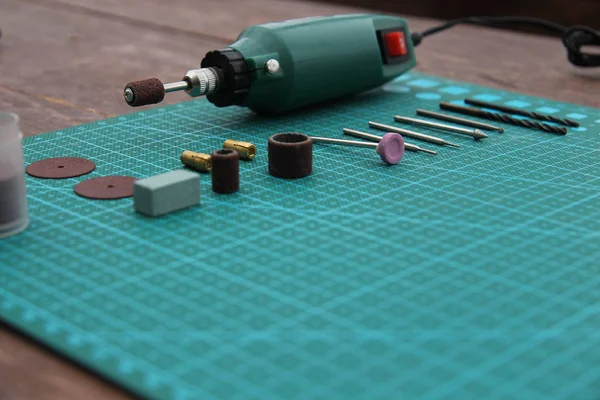 hand drill with tools on table