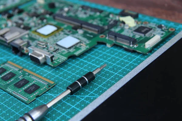 electronics repair on the table green substrate