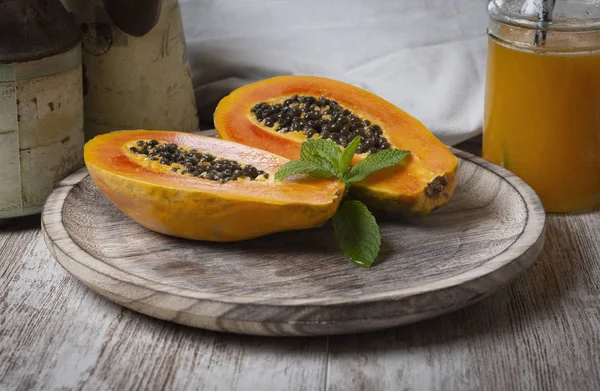 Papaya fruit and papaya juice - image