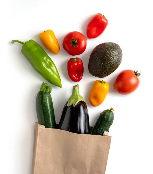 Fresh vegetables in recyclable paper bag isolated from the background. contains clipping path